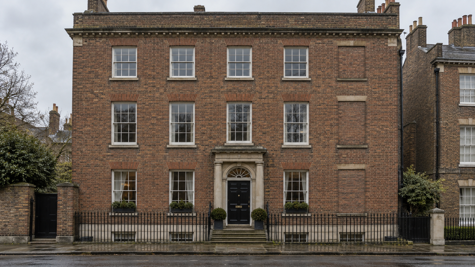 Historic Georgian building with a former window opening filled in with brick